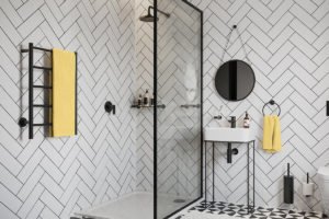 Bathroom setting with NATURAL 5 Bar Champagne G Matt Black heated towel rail next to shower