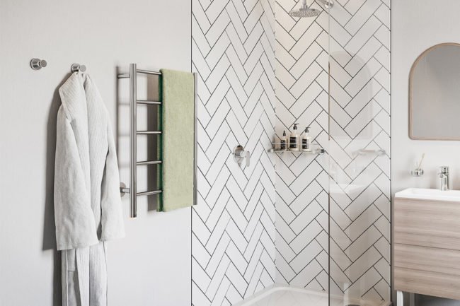 Bathroom setting with NATURAL 5 Bar heated towel rail next to shower