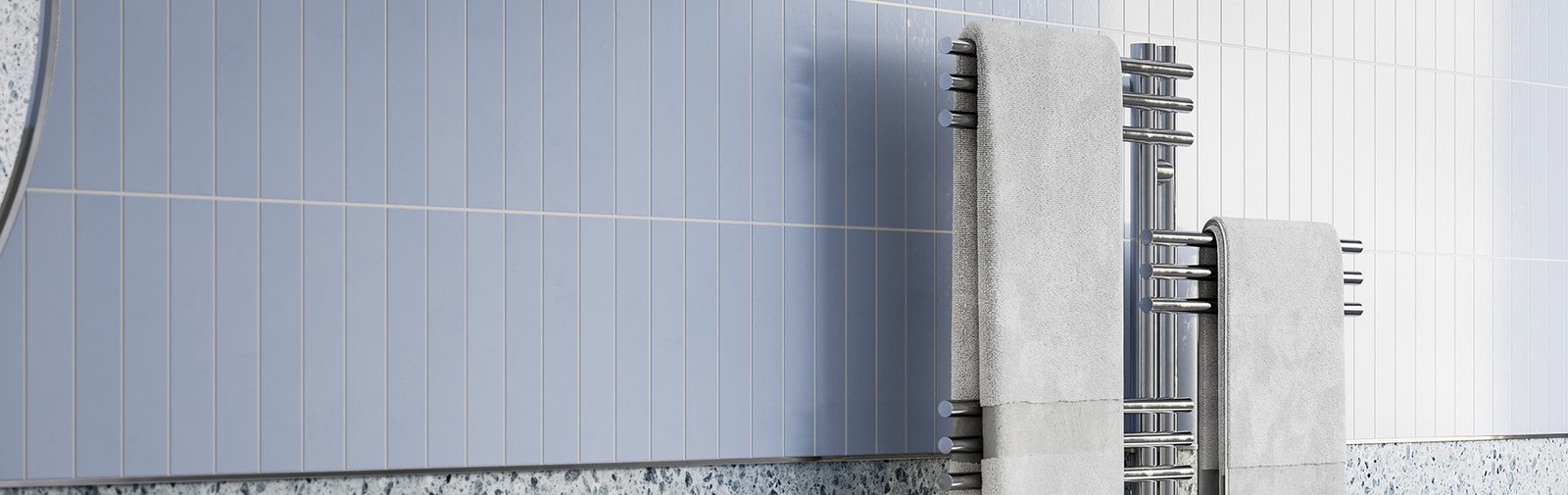 Loft Duo 12 Bar heated towel rail 1000mm wide on blue tiled wall